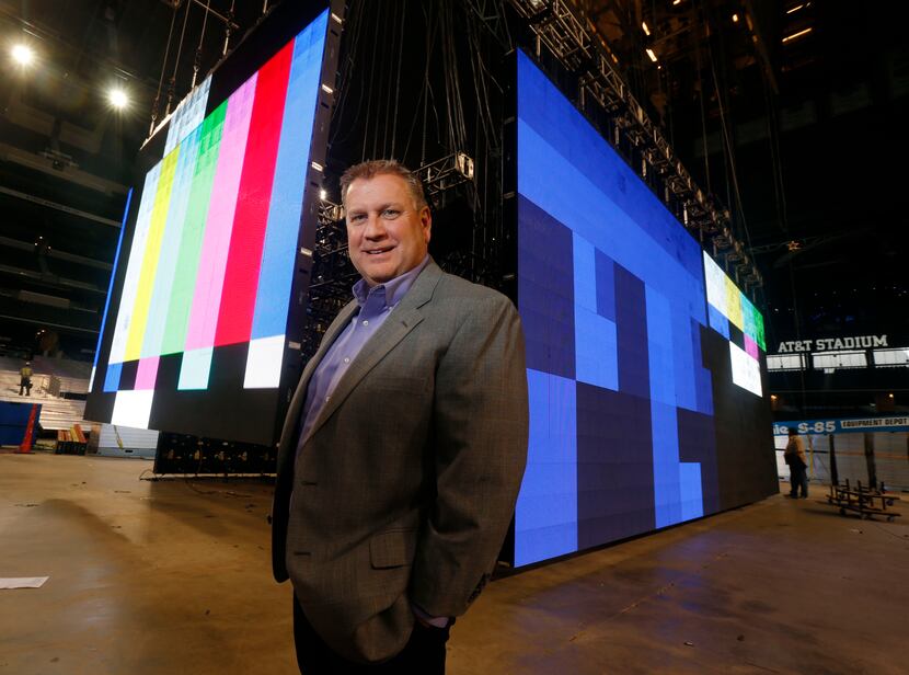 Chris Curtis, CEO of GoVision, is shown with the giant screens the company installed for the...