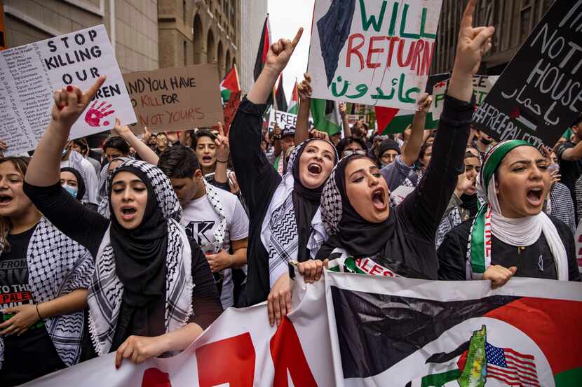 Demonstrators in Sunday's pro-Palestine event rallied at Dallas' Belo Garden before marching...