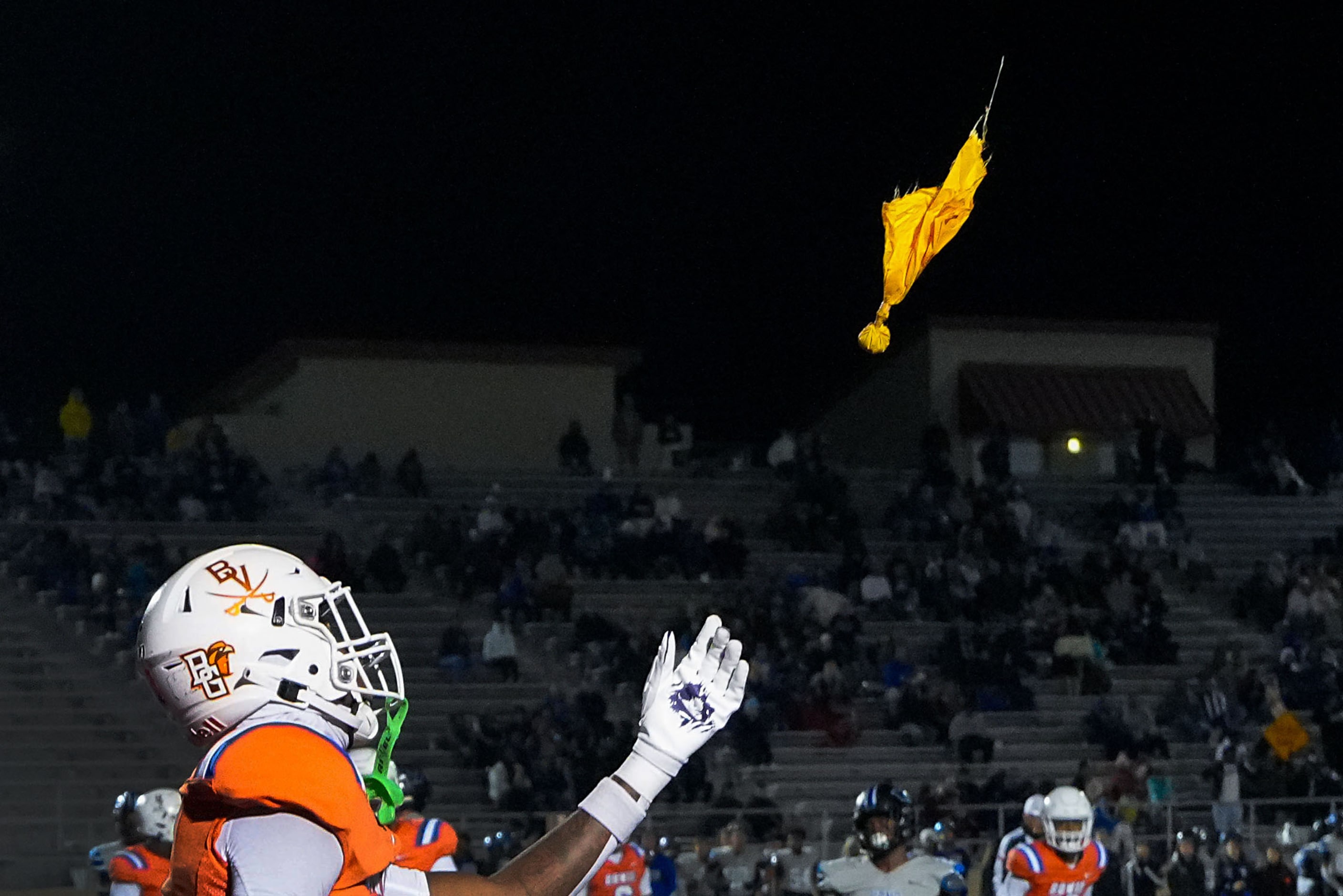 Arlington Bowie wide receiver Dilon Tallie reaches for a penalty flag thrown against Hebron...