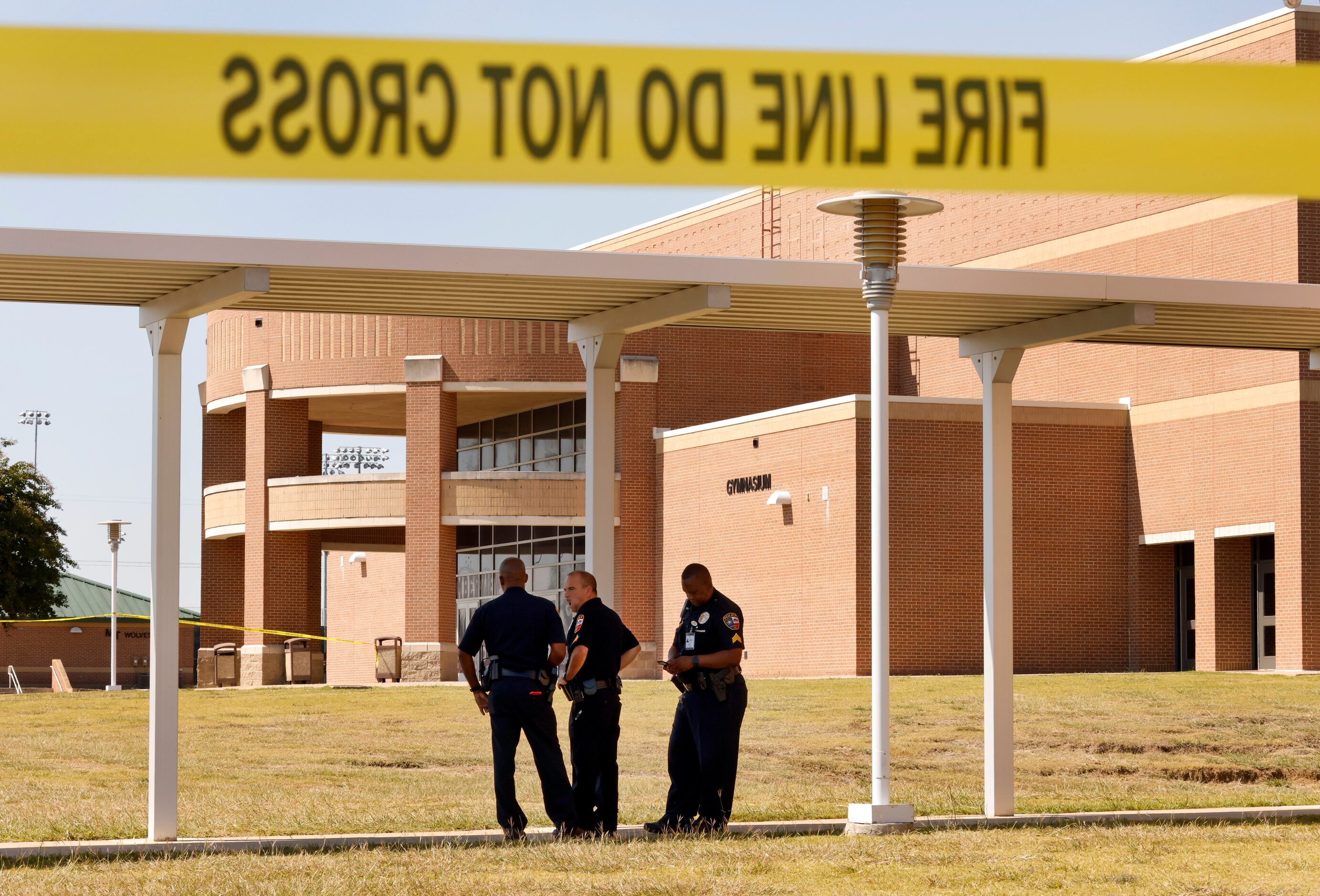 Mansfield ISD police officers secure the door where most of the activity took place...