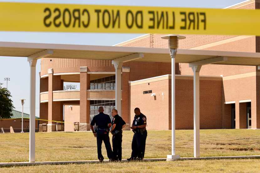Mansfield ISD police officers outside Mansfield Timberview High School in Arlington on Oct....