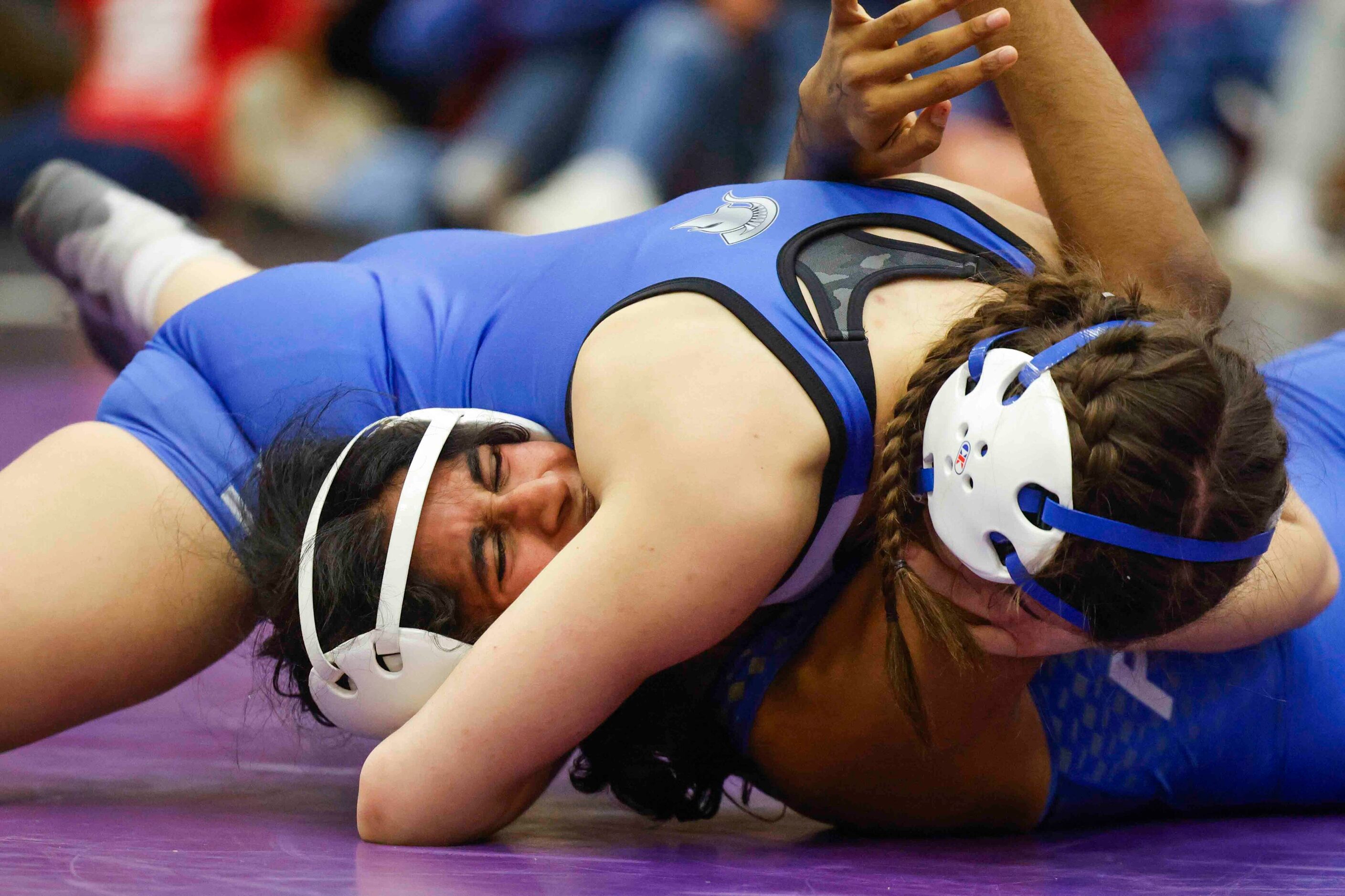 Manya Vennapu of Frisco (left) wrestles against Maritza Martinez of Burleson Centennial...