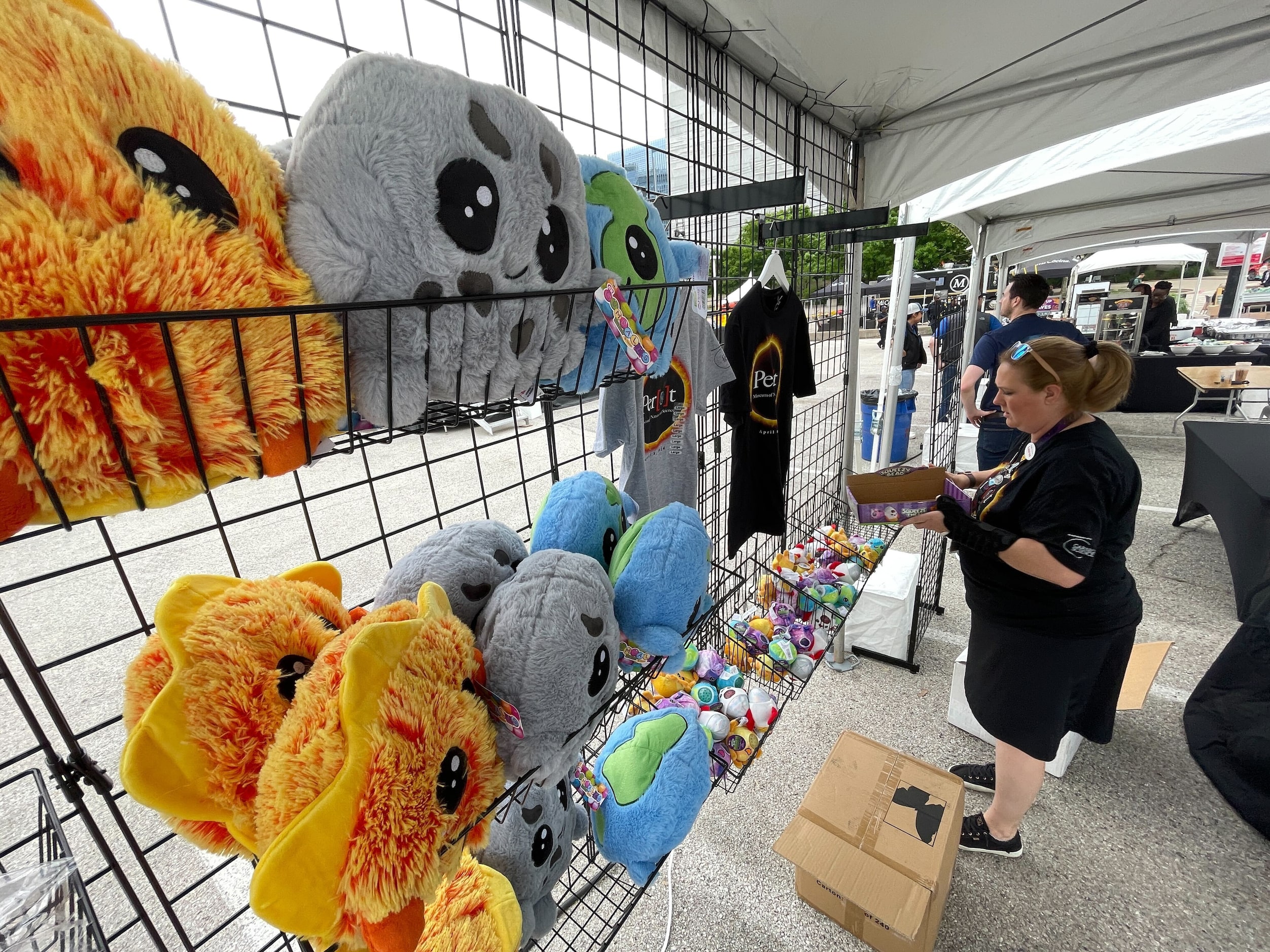 Lauren Cartwright, store director at the Perot Museum of Nature and Science, stocks...