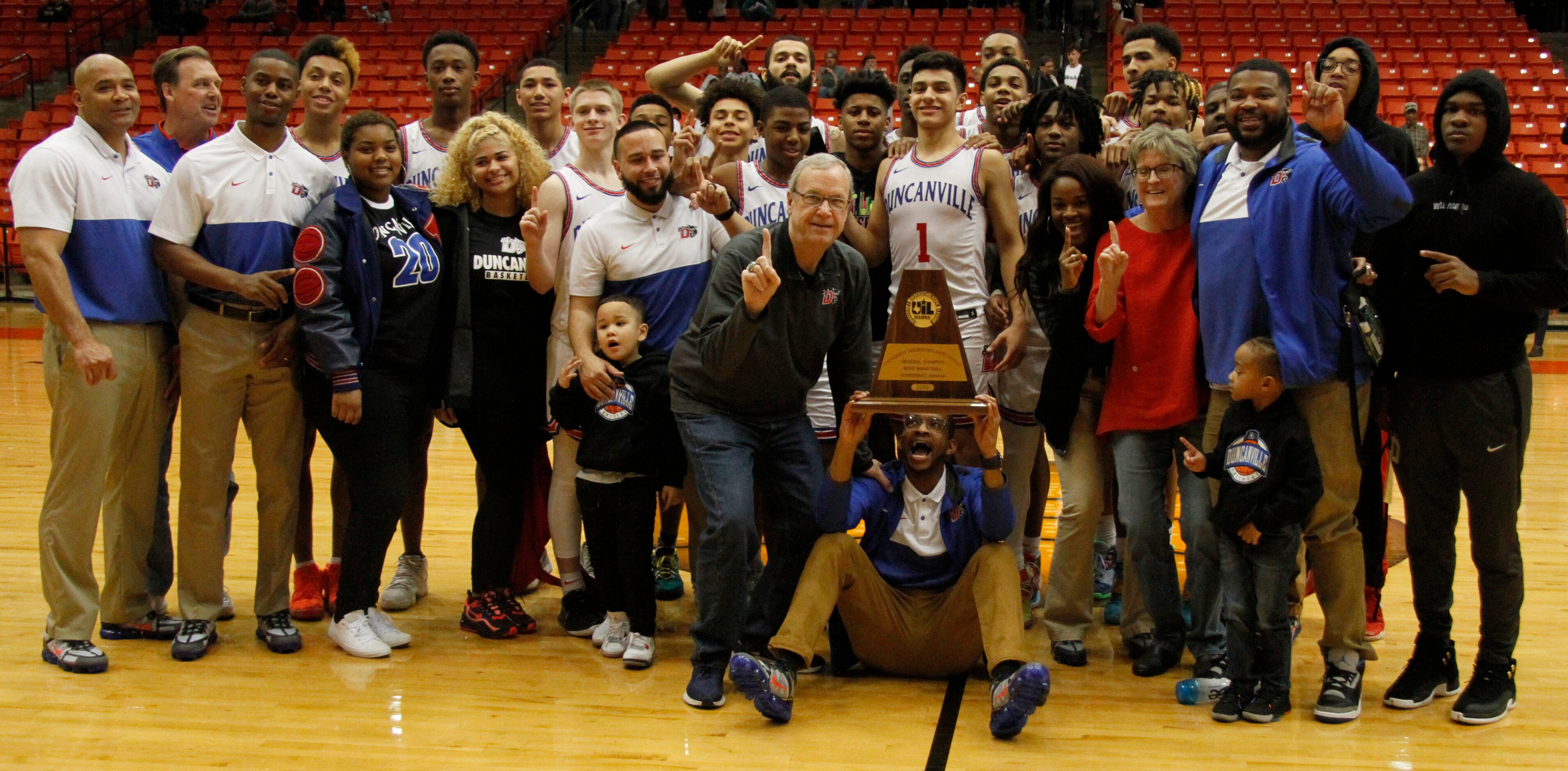 Former Panthers head coach Phil McNeely was placed front and center for the team photo as...