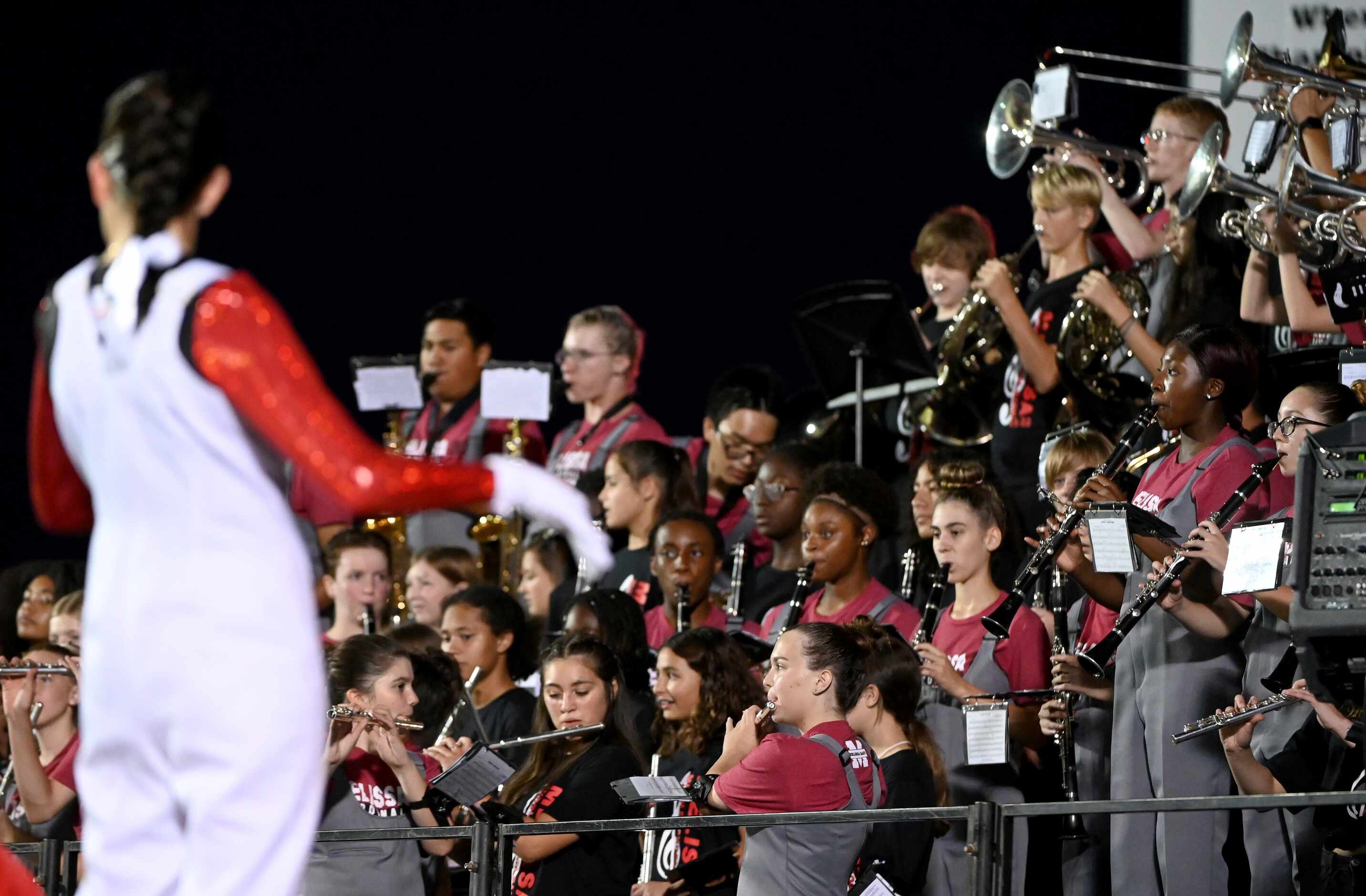 The Melissa band performs in the first half of a high school football game between Argyle...