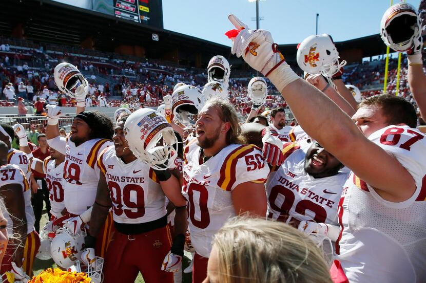 Iowa State players celebrate after an NCAA college football game against Oklahoma in Norman,...