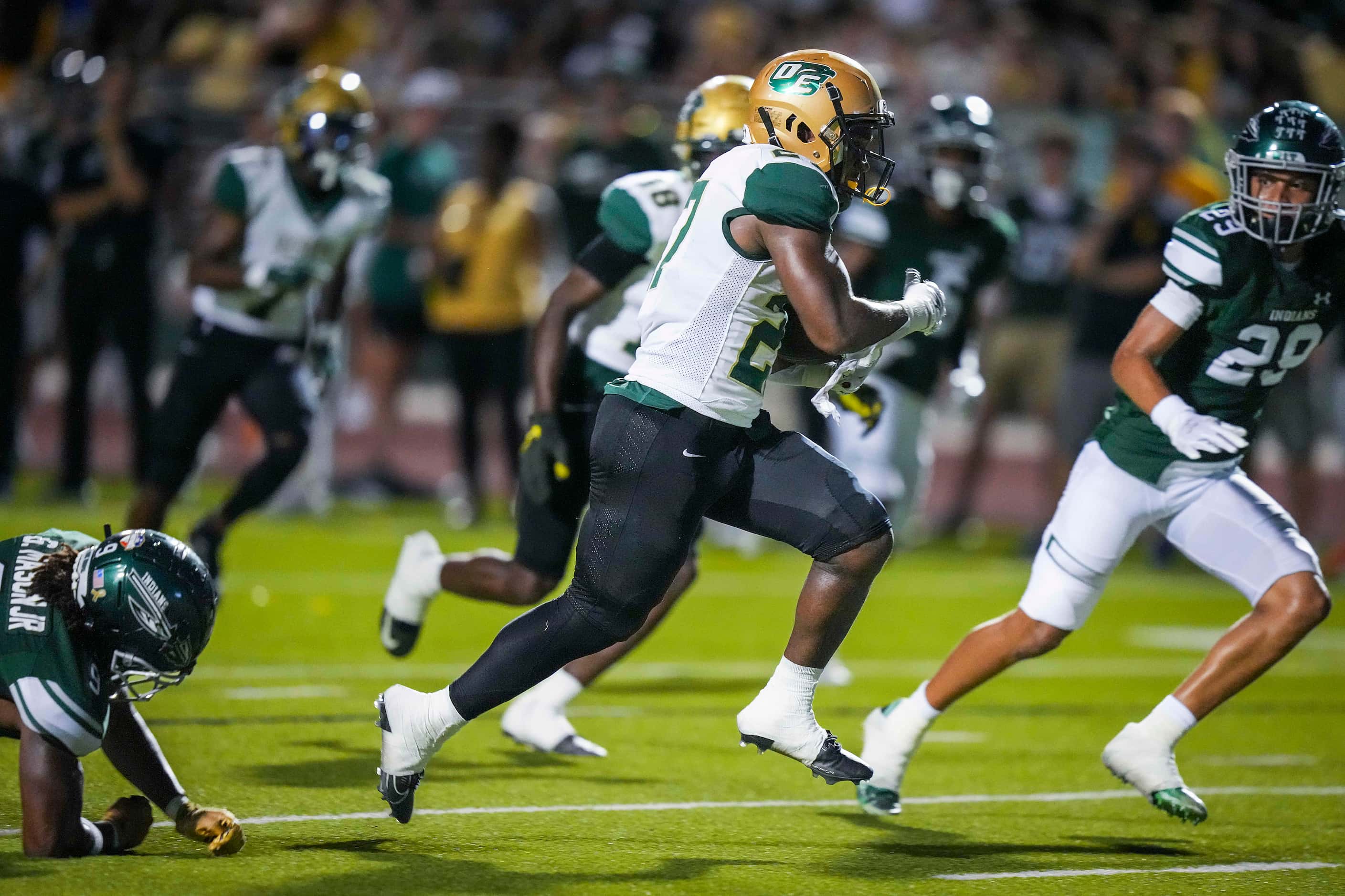 DeSoto  running back Marvin Duffey (27) races through the Waxahachie defense on a 14-yard...