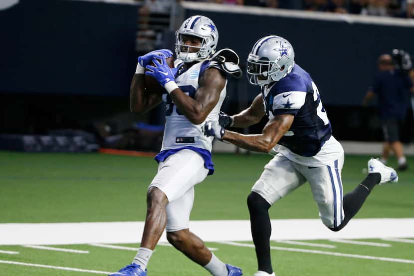 Dallas Cowboys wide receiver Dez Bryant (88) runs to the end zone after catching a pass over...