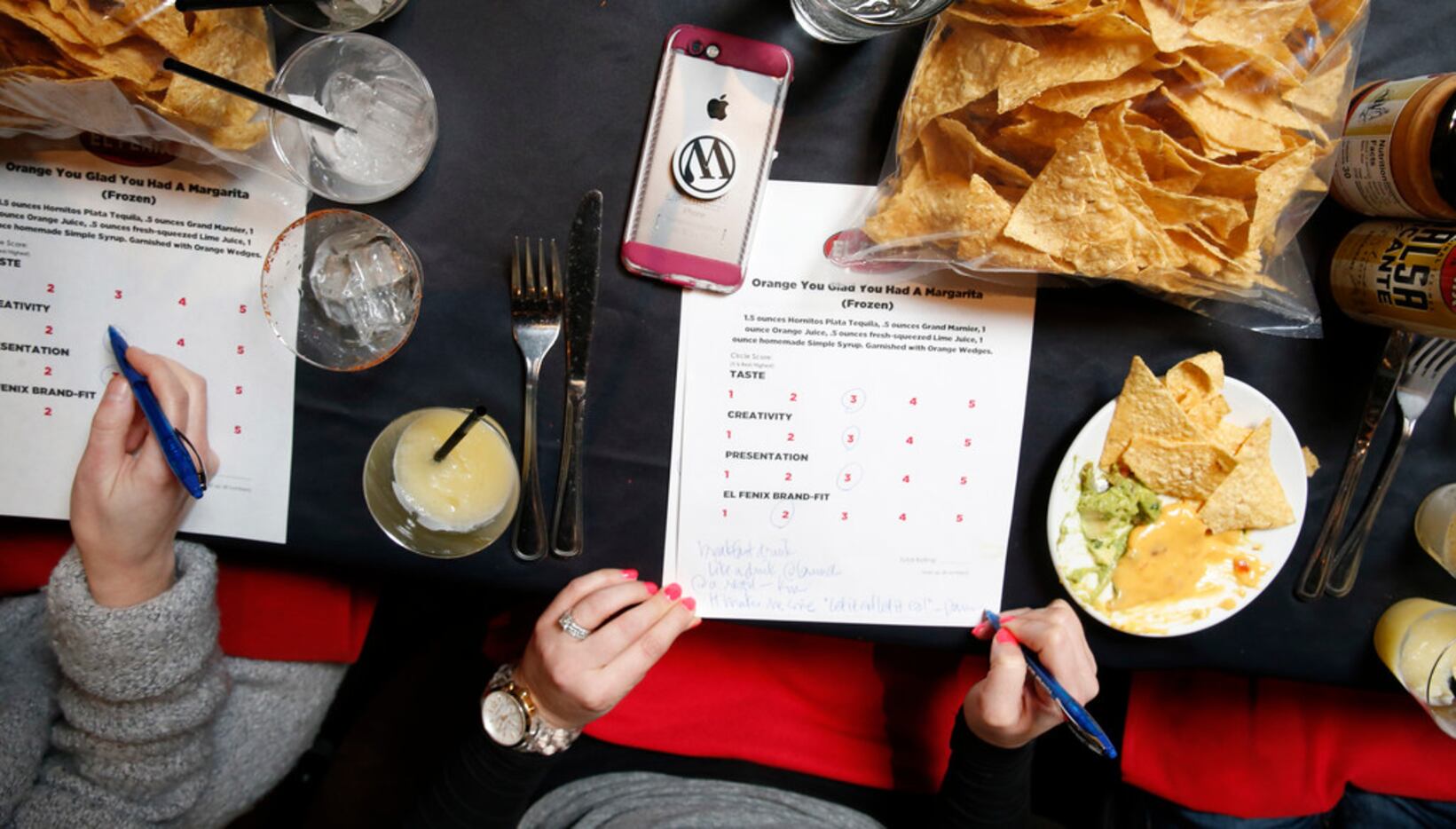 Judges write up scores during the margarita taste test at El Fenix in Dallas on Feb. 22,...