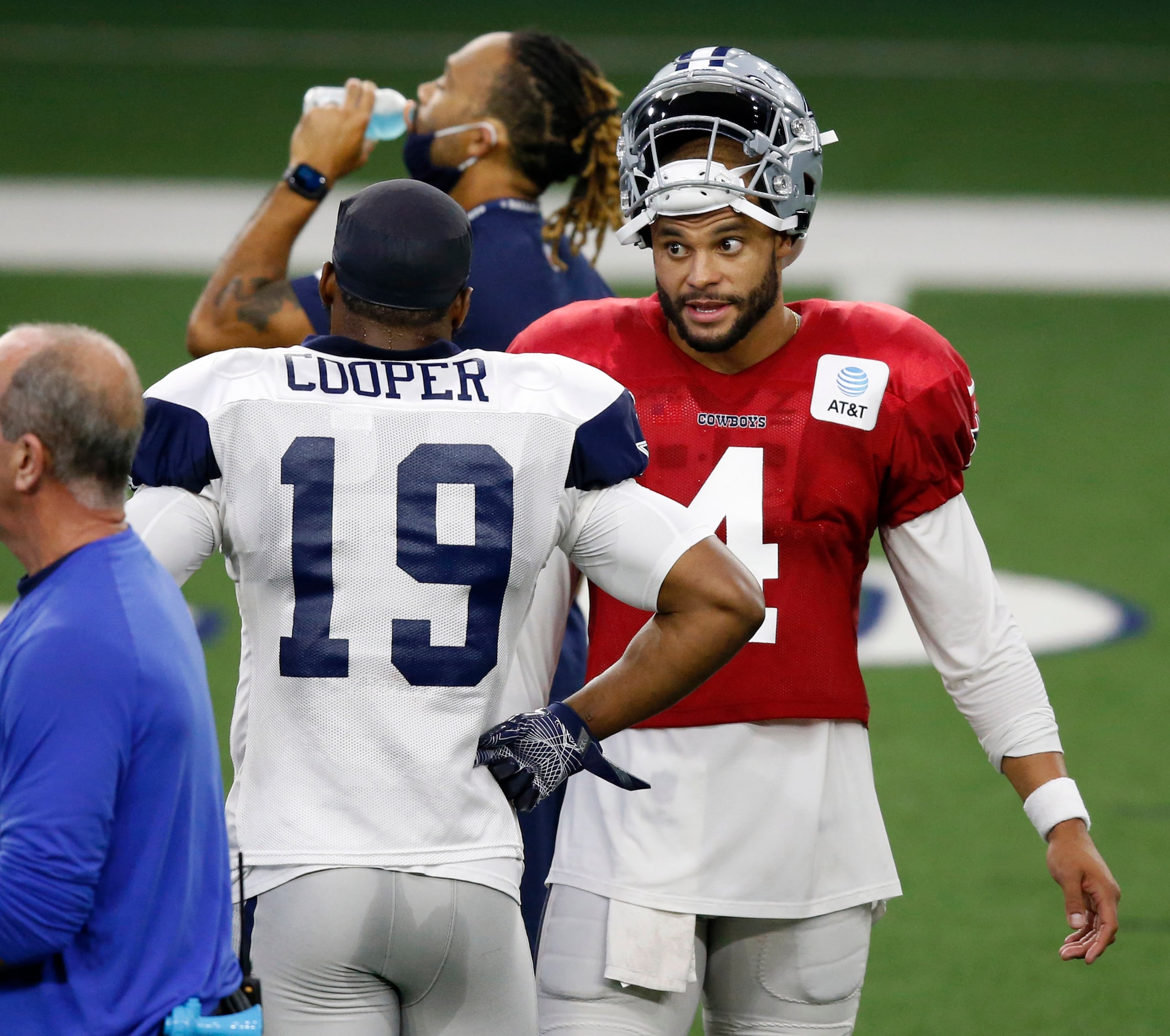 Dallas Cowboys quarterback Dak Prescott (4) talks to Dallas Cowboys wide receiver Amari...