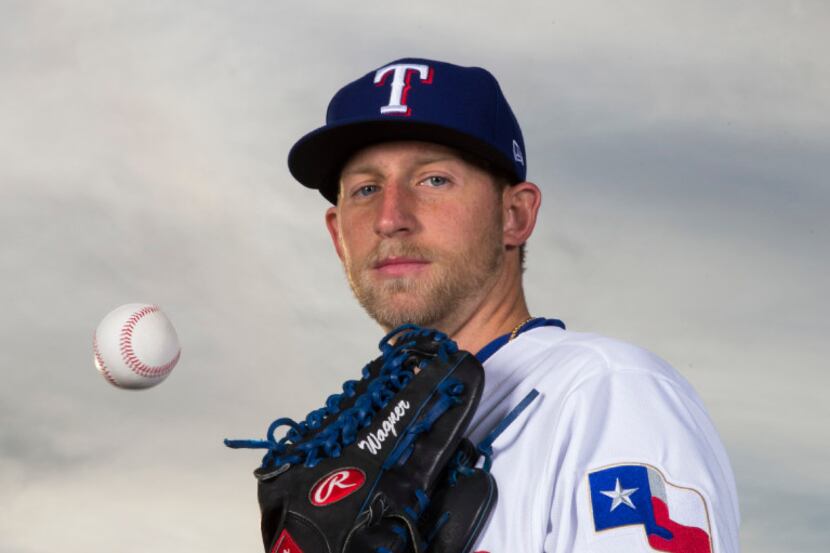 Texas Rangers starting pitcher Tyler Wagner (53) poses for a portrait on photo day during...