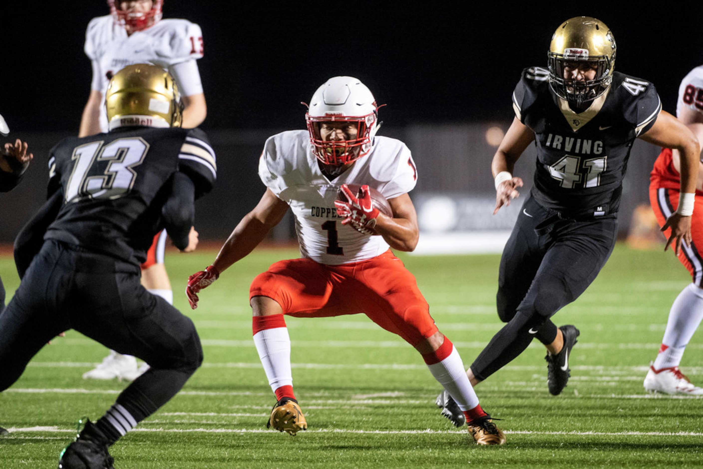 Coppell senior running back De Heath (1) cuts back against Irving senior defensive back...