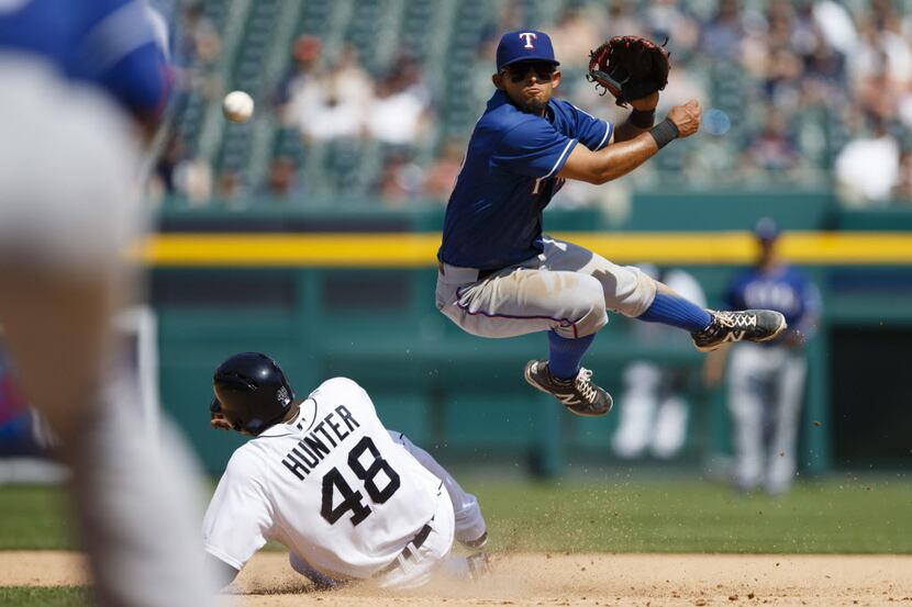 May 25, 2014; Detroit, MI, USA; Texas Rangers second baseman Rougned Odor (73) makes a throw...