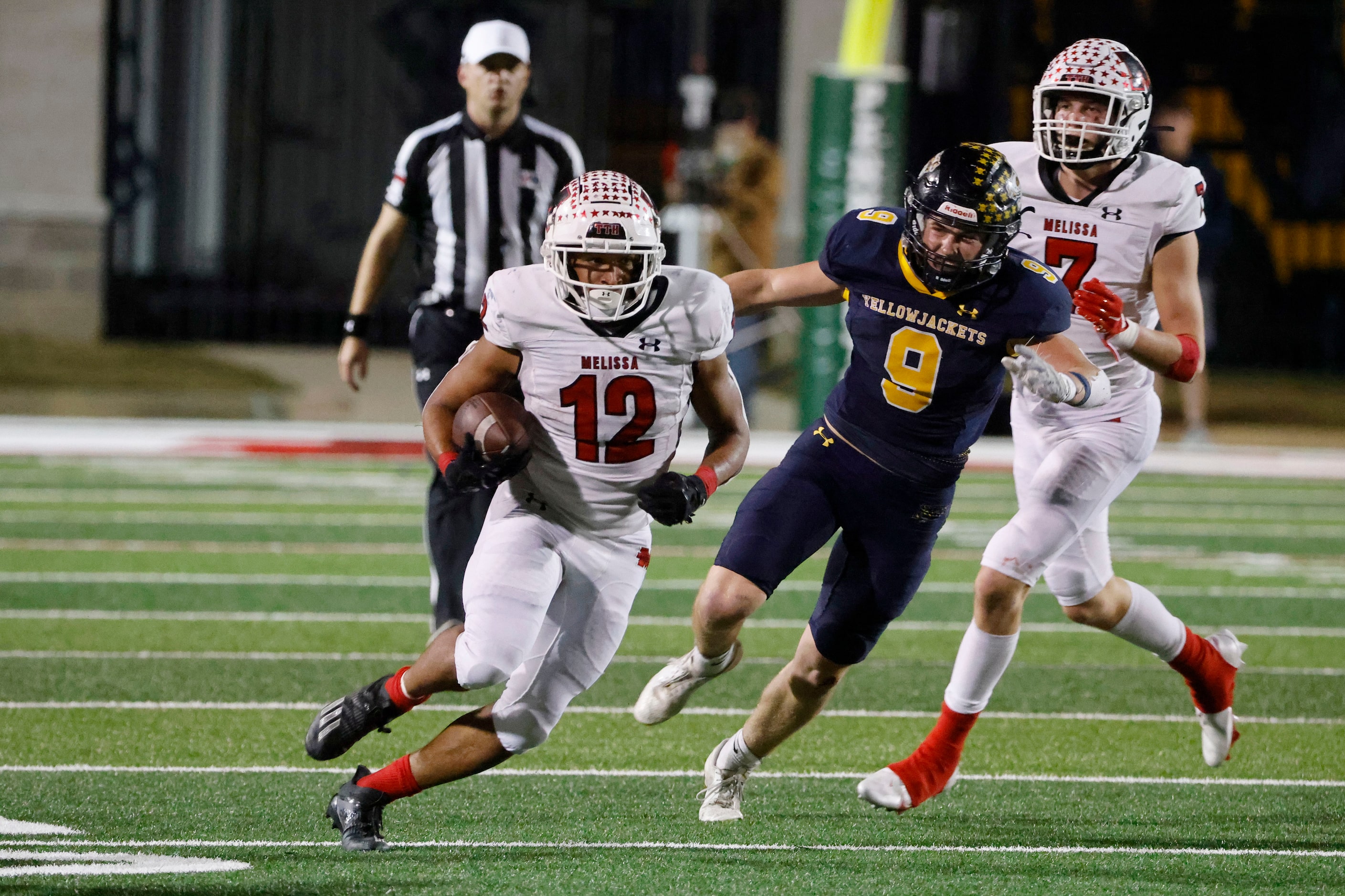 Melissa running back Ashton Mitchell-Johnson (12) runs past Stephenville’s Corbin Poston (9)...