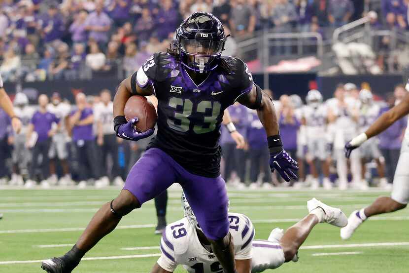 TCU Horned Frogs running back Kendre Miller (33) breaks loose of Kansas State Wildcats...