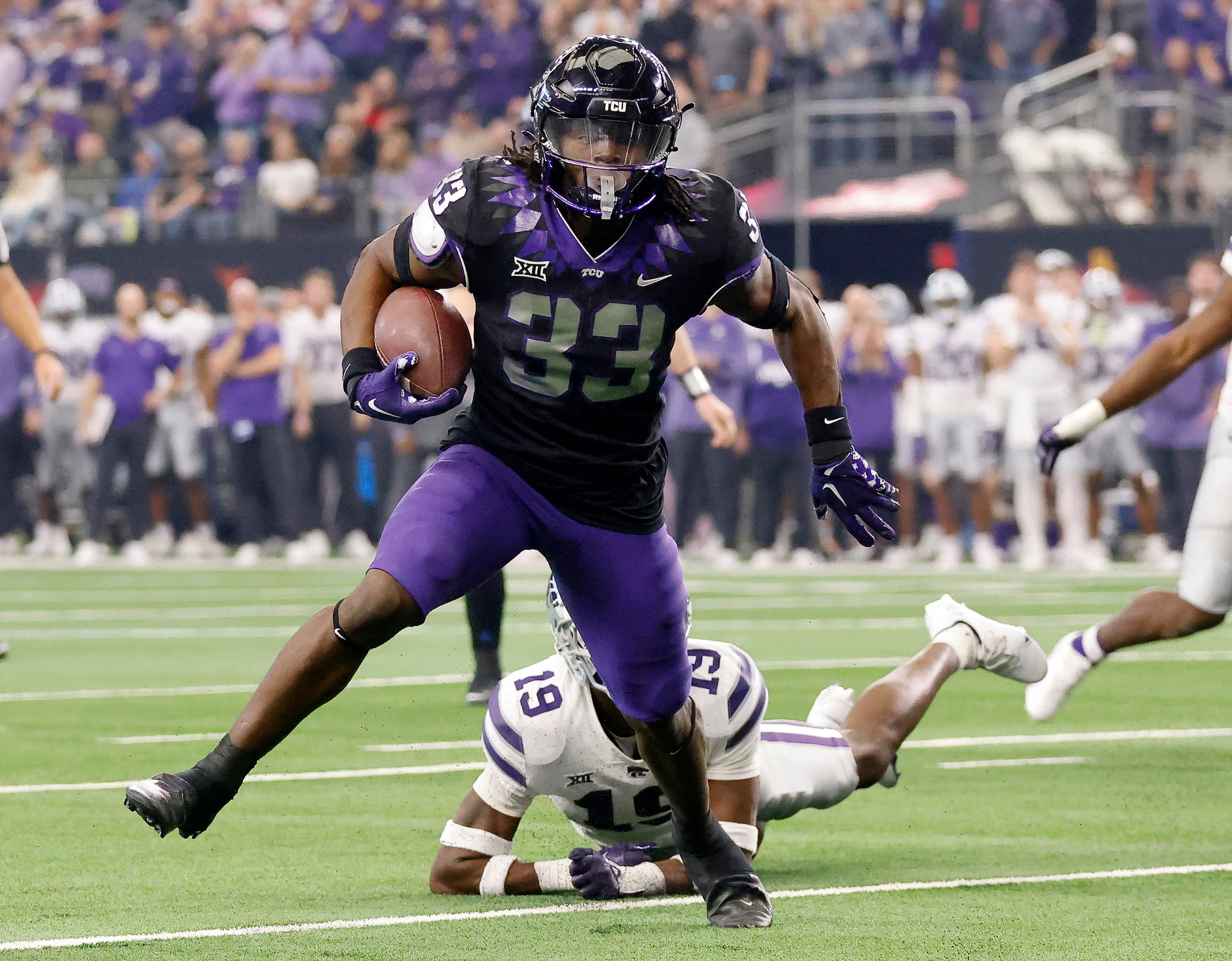 TCU Horned Frogs running back Kendre Miller (33) breaks loose of Kansas State Wildcats...