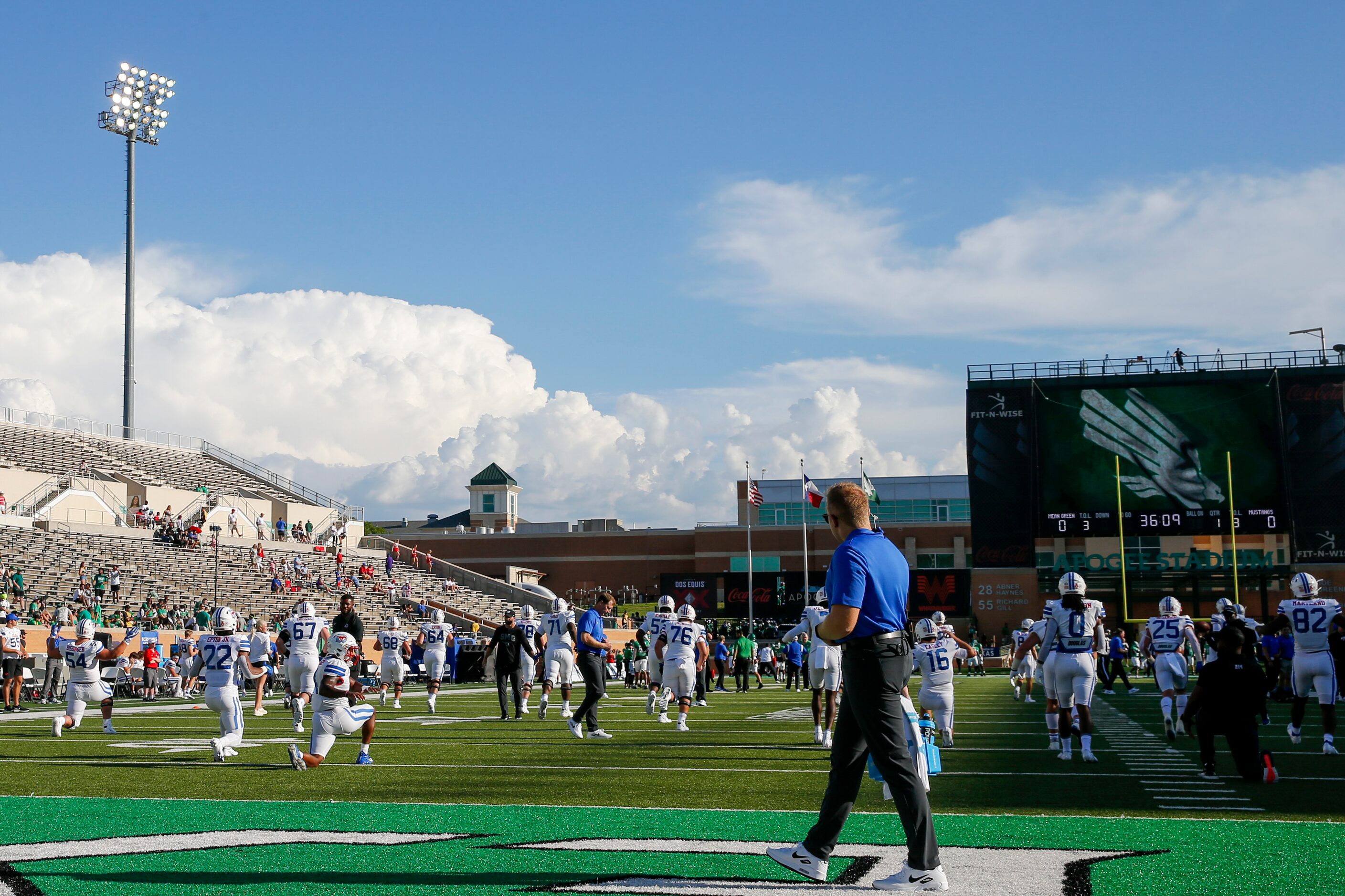 SMU players warm-up before a game against UNT at Apogee Stadium in Denton, Saturday, Sept....