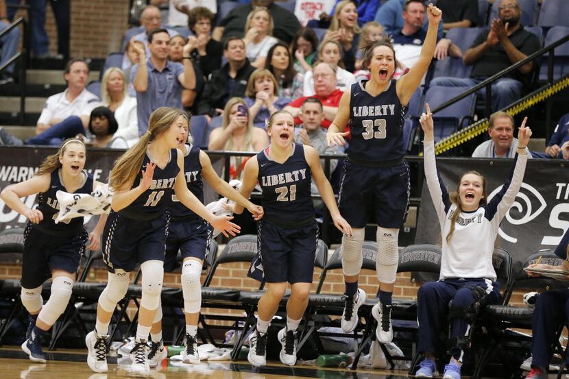 Liberty Christian celebrate winning the TAPPS 5A girls basketball state championship game...