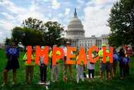 On Sept. 26, 2019, protesters held up letters reading "impeach" in front of the U.S. Capitol...