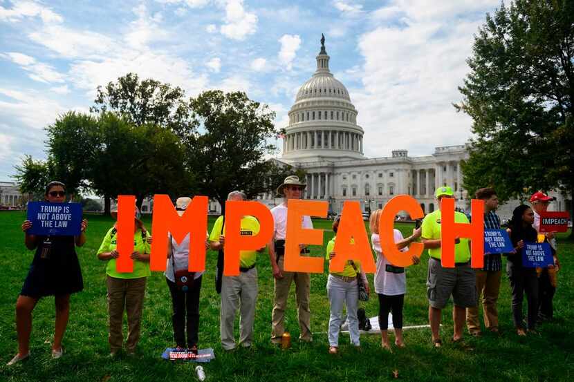 On Sept. 26, 2019, protesters held up letters reading "impeach" in front of the U.S. Capitol...