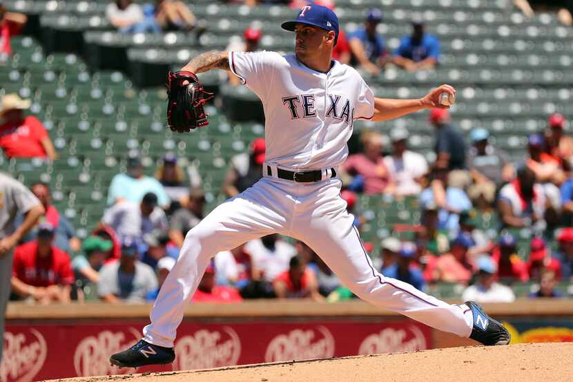 ARLINGTON, TEXAS - JUNE 08: Joe Palumbo #62 of the Texas Rangers pitches in the second...