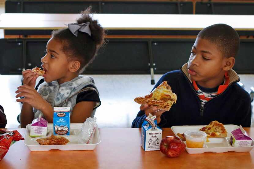 
Paige Baker, 7, joined DJ as they dug into pizza on Tuesday.
