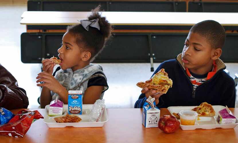 
Paige Baker, 7, joined DJ as they dug into pizza on Tuesday.
