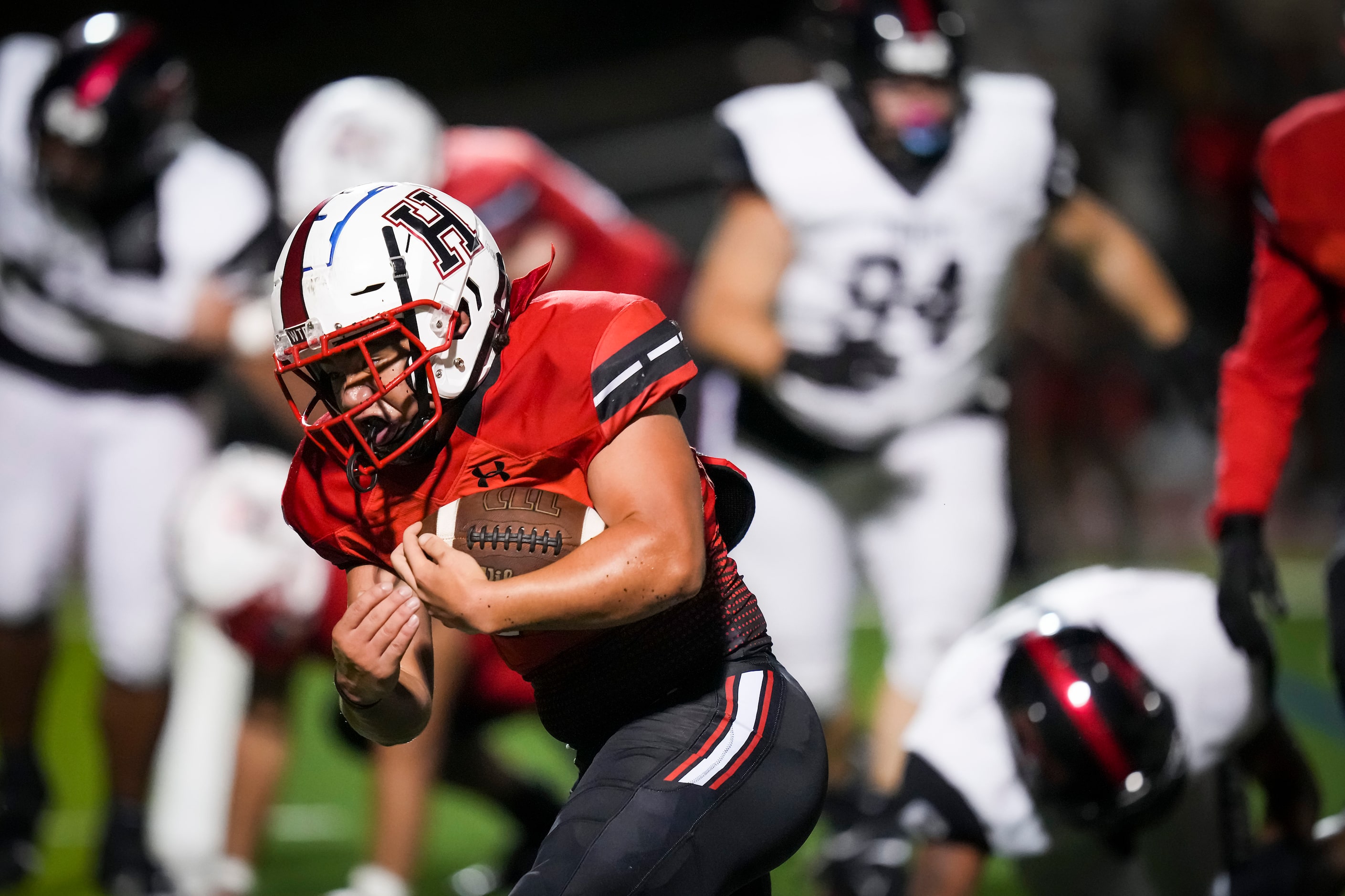 Rockwall-Heath running back Hayden Gentry (32) breaks through the Euless Trinity defense on...