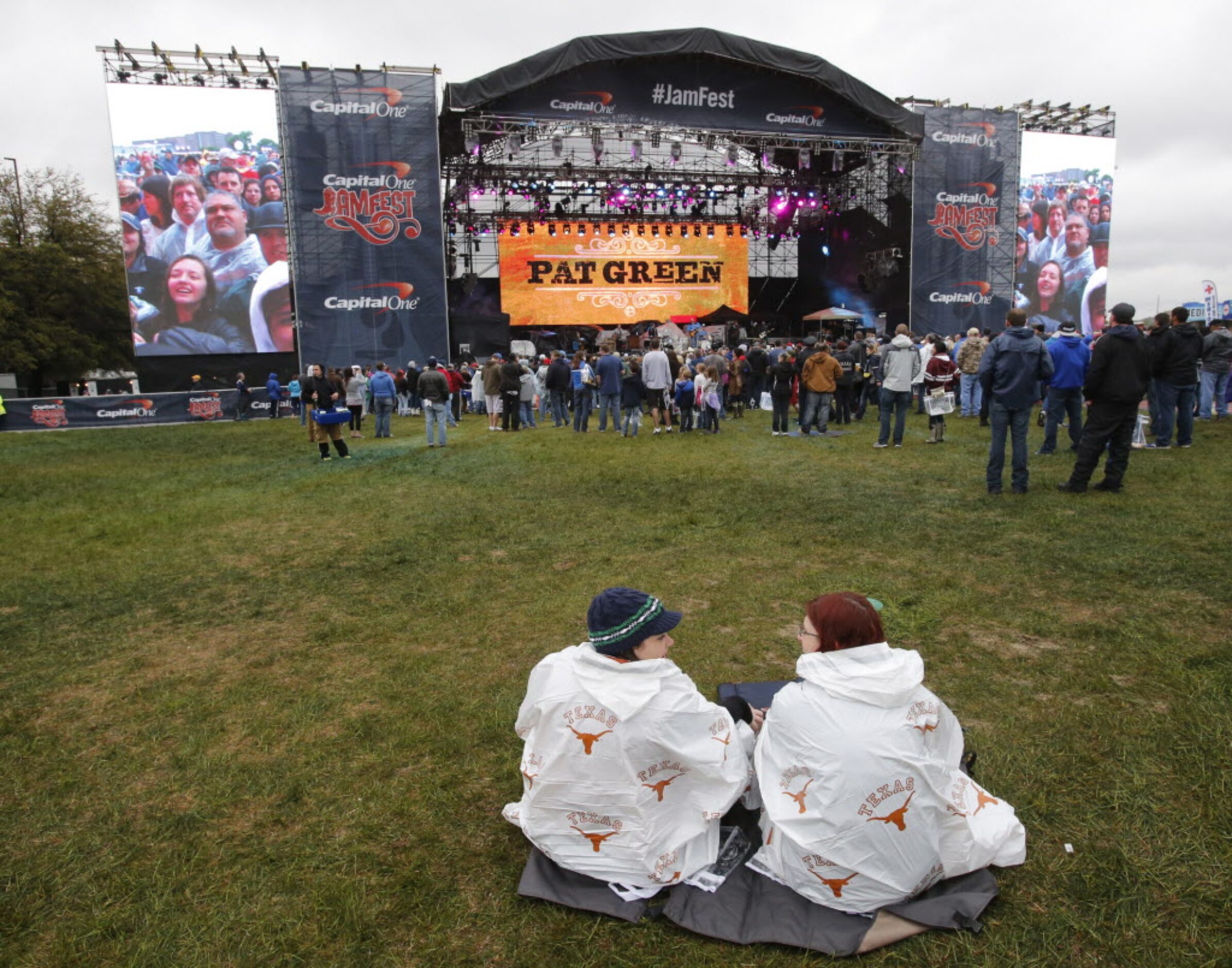 Rachel Hull, left, and Lucy Hale listen to Pat Green perform during the March Madness Music...