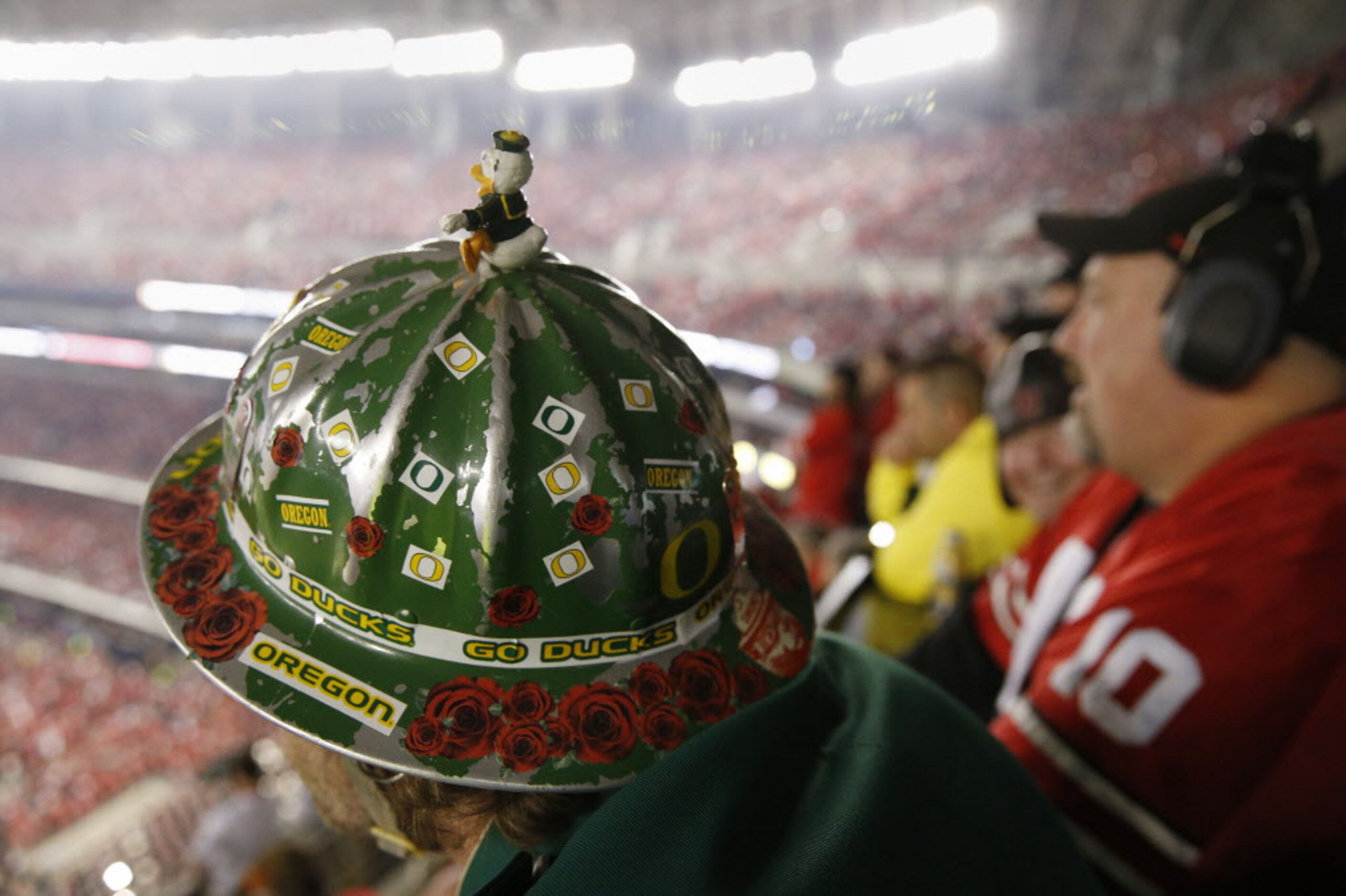 Oregon Ducks fan Warner Munro, of Portland, Oregon, watches action in the first quarter...