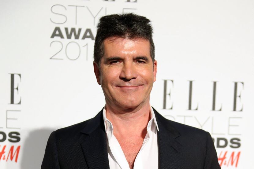   Simon Cowell poses for photographers at the Elle Style Awards in London. NBC announced...