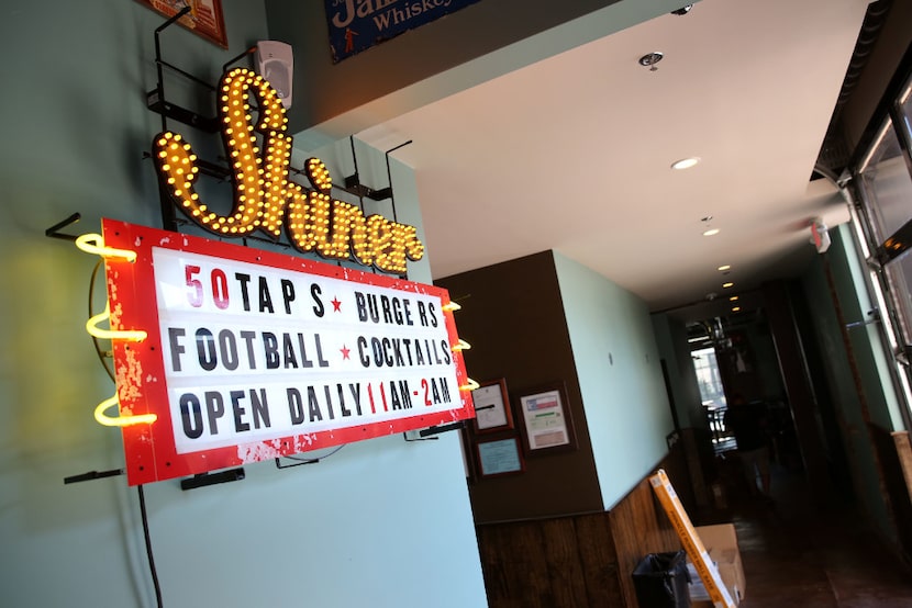 Interior of Little Woodrow's in Dallas is decorated with kitschy signs. 