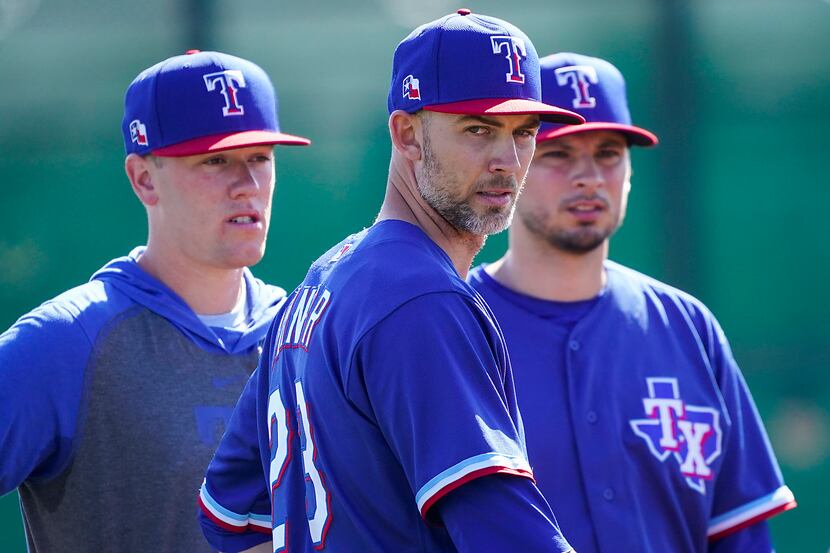 Texas Rangers pitcher Mike Minor (participates in a fielding drill during a spring training...