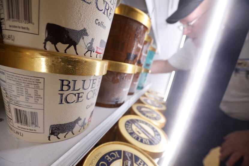 Robert Horton, route supervisor for Blue Bell Ice Cream, fills the refrigerated ice cream...