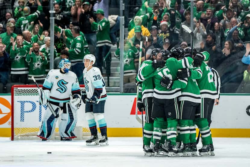 The Dallas Stars celebrate after center Matt Duchene's second goal of an NHL hockey game in...