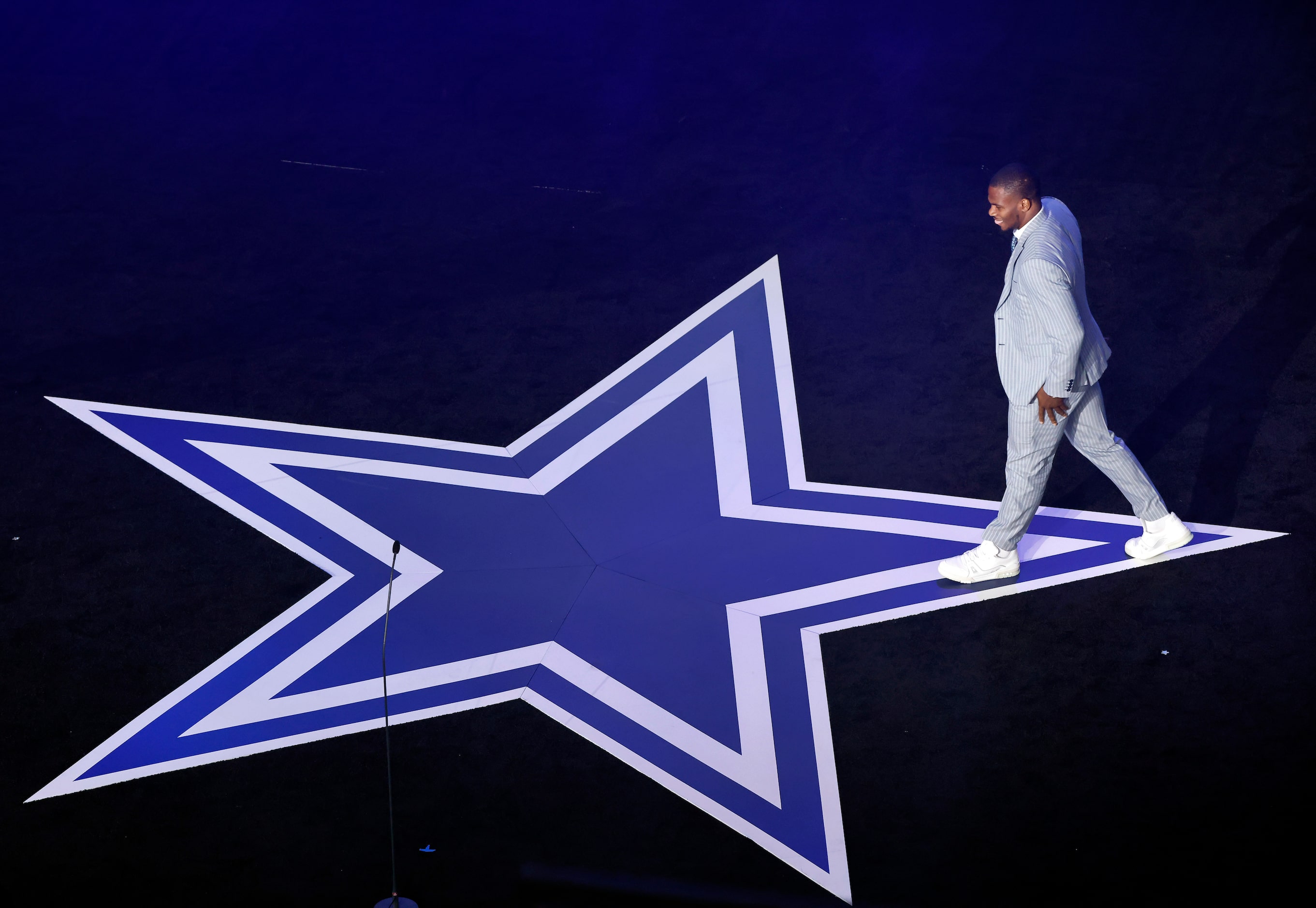 Dallas Cowboys linebacker Micah Parsons walks across the star to receive The Playmaker Award...