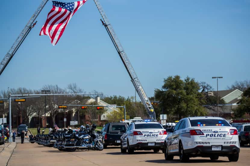  Police escort the body of Euless police Officer David Hofer after a memorial service....