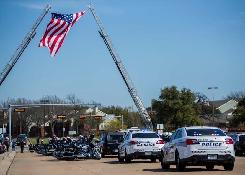  Police escort the body of Euless police Officer David Hofer after a memorial service....