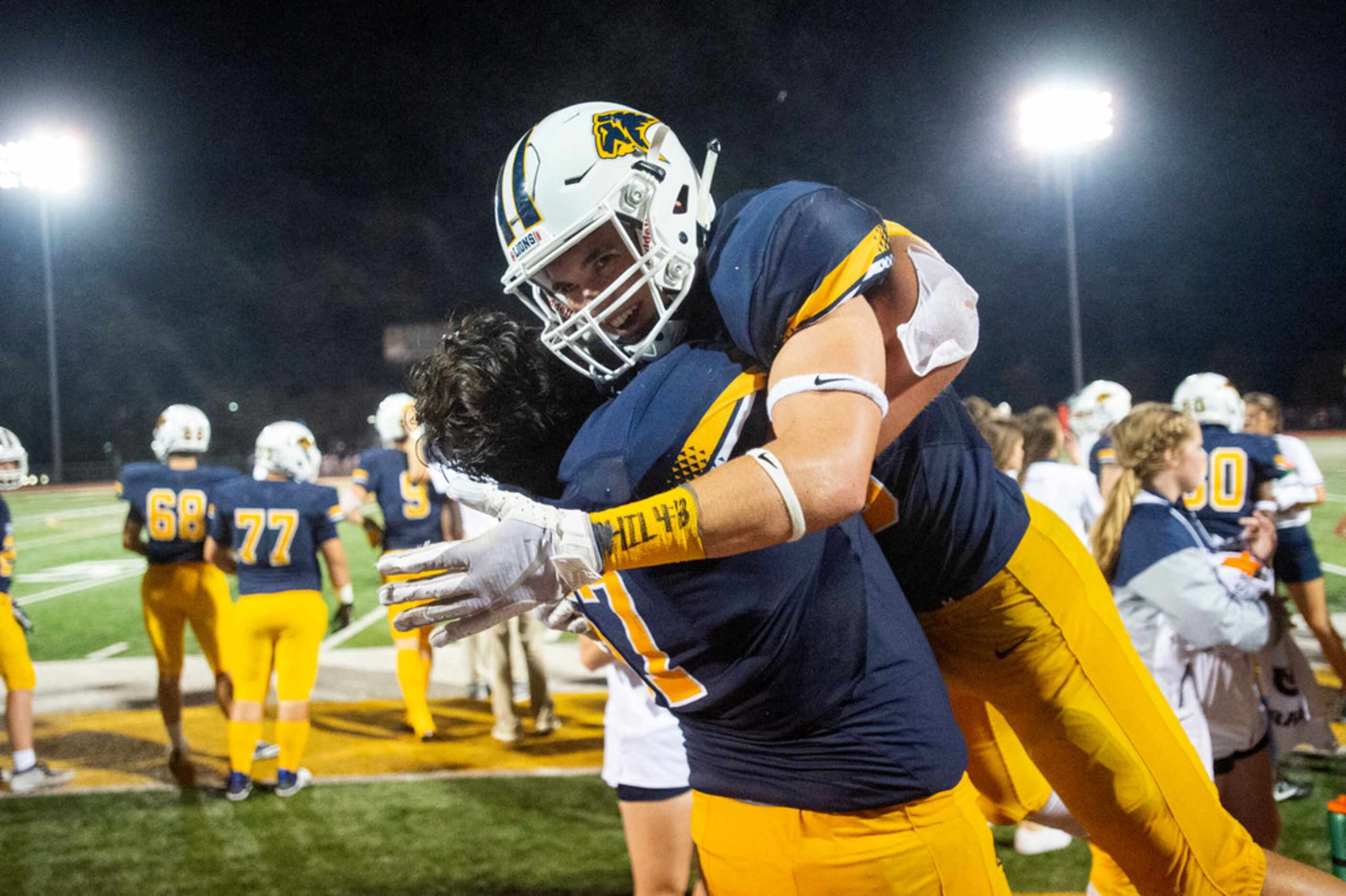 Plano Prestonwood Christian junior defensive back Michael Graham (30) is lifted in...