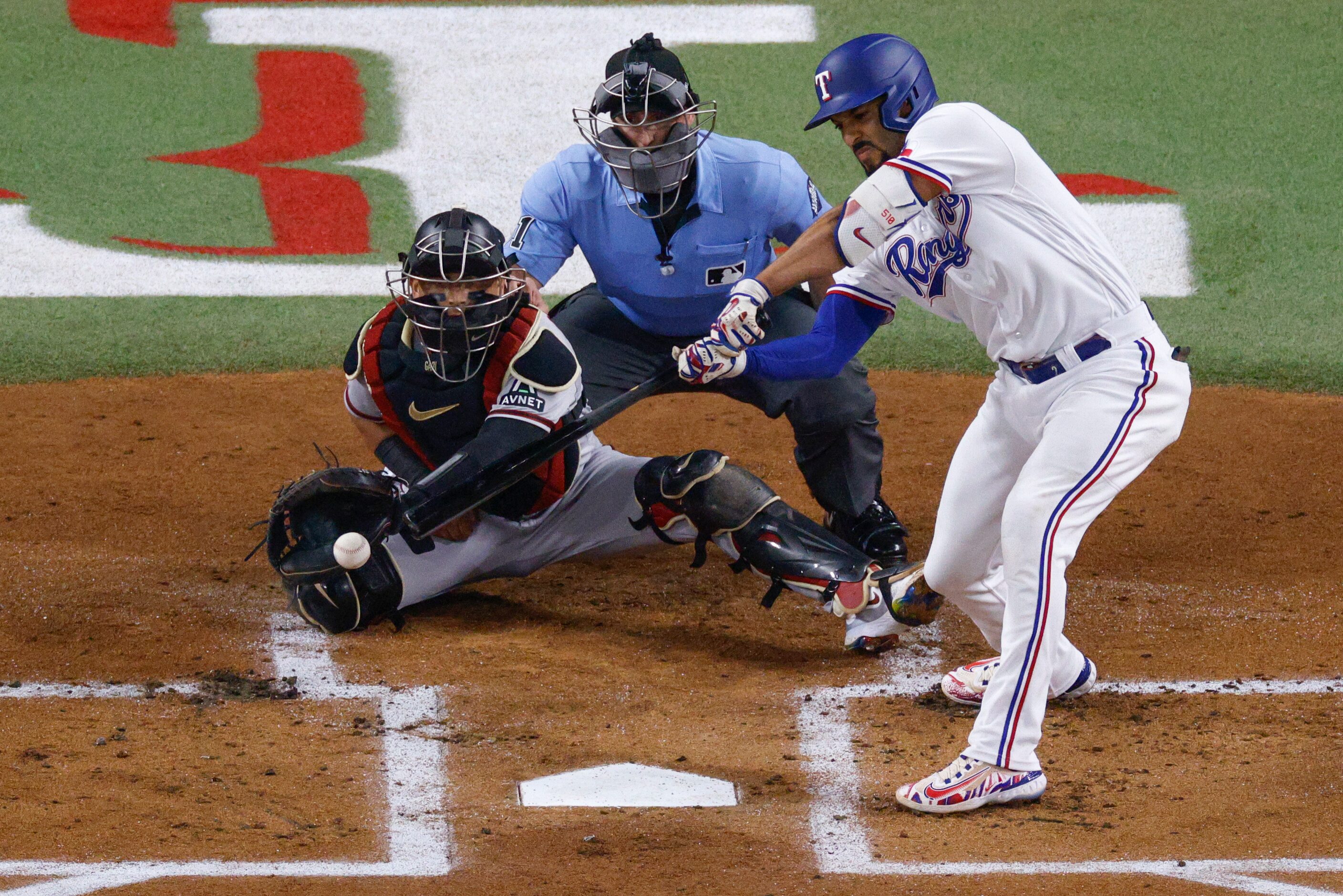 Texas Rangers second baseman Marcus Semien (2) strikes out swinging during the first inning...