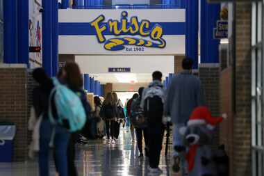 Students walk the halls at Frisco High School in Frisco.