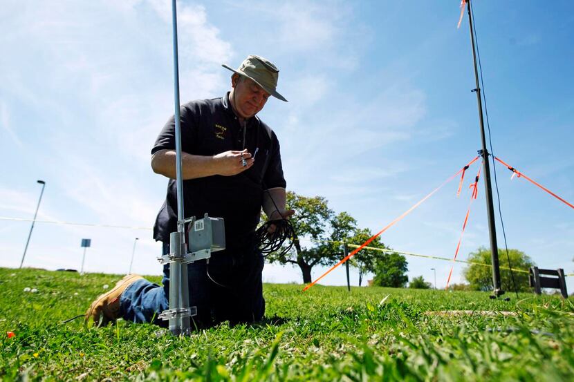 
Kevin Grantham, call sign N5KRG, of Farmers Branch, prepares an antenna for use as members...