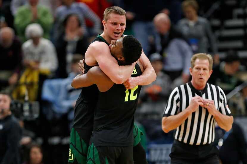 Baylor guard Makai Mason, left, and guard Jared Butler (12) celebrate the team's win against...