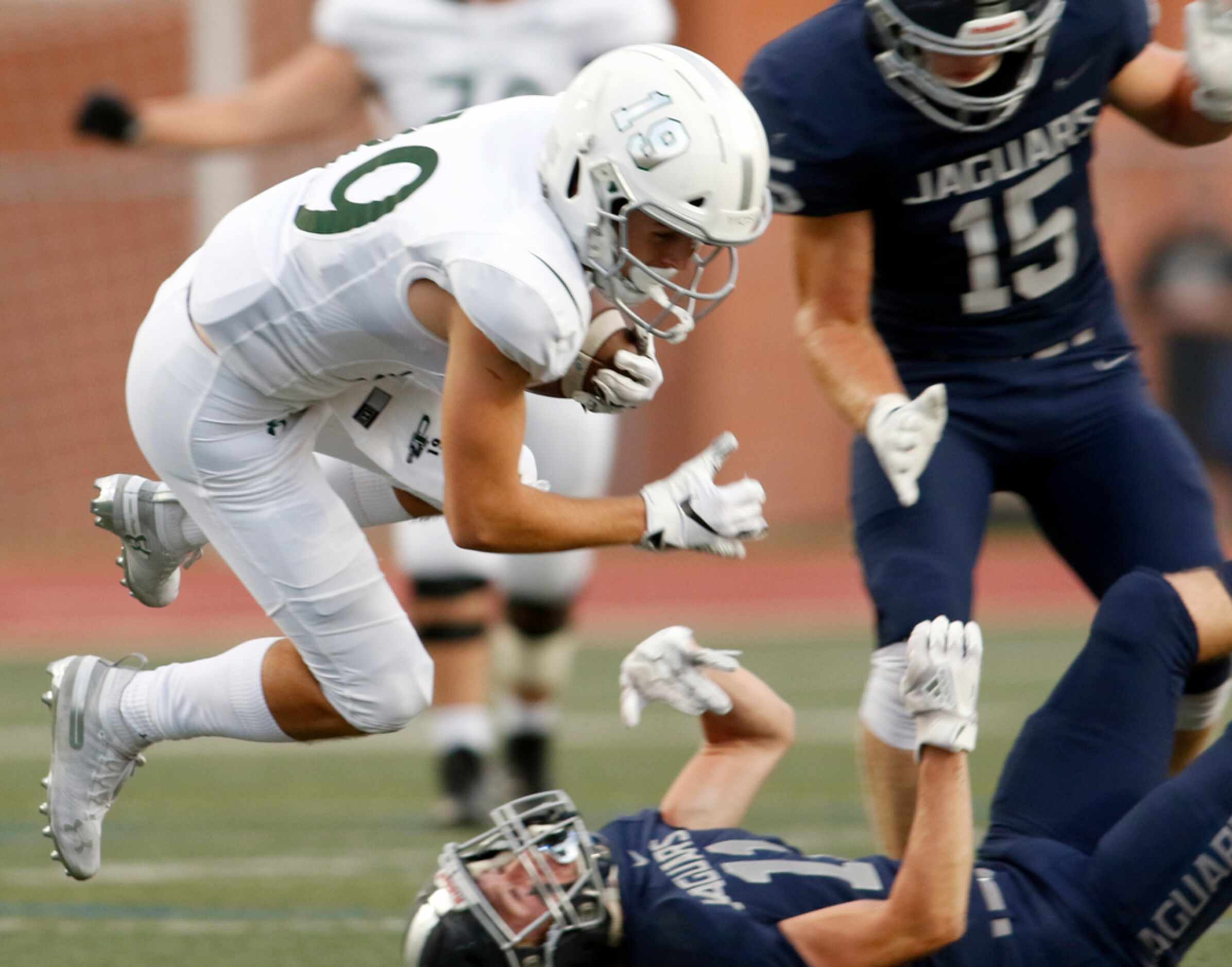 Prosper receiver Keaton Nickerson (19) is catapulted for extra yardage after Flower Mound...