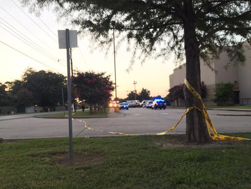  Police tape surrounds the scene following a shooting at a movie theater Thursday in...