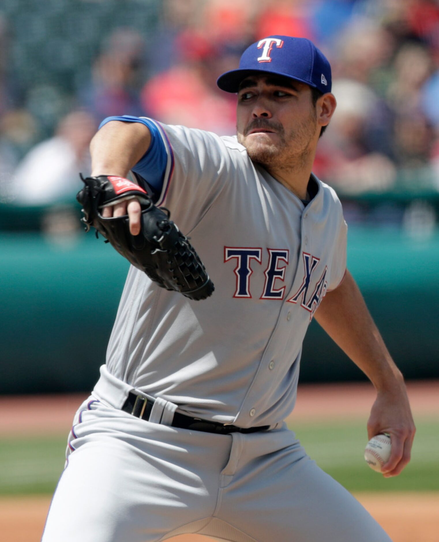 Texas Rangers starting pitcher Matt Moore delivers in the first inning of a baseball game...