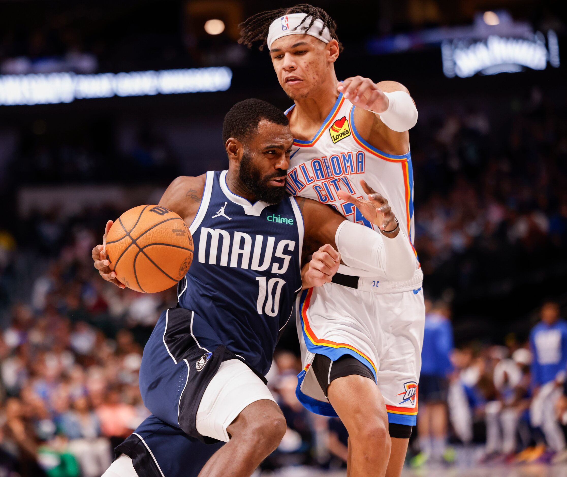 Dallas Mavericks forward Tim Hardaway Jr. (10) pushes past Oklahoma City Thunder forward...