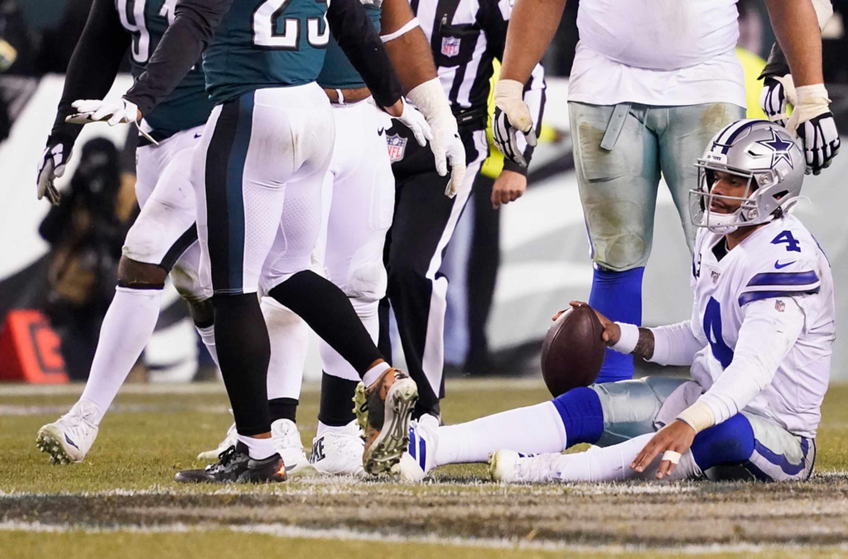 Dallas Cowboys quarterback Dak Prescott (4) gets up after being sacked during the second...