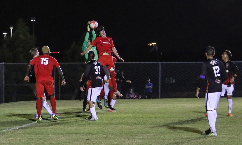 Ex-FC Dallas goalkeeper Eduardo "Pollo" Cortes of NTX Rayados goes up for a cross against FC...