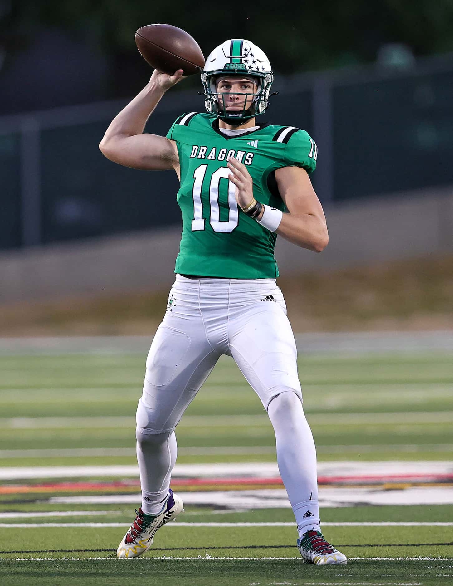 Southlake Carroll quarterback Graham Knowles (10) looks to make a pass against Flower Mound...
